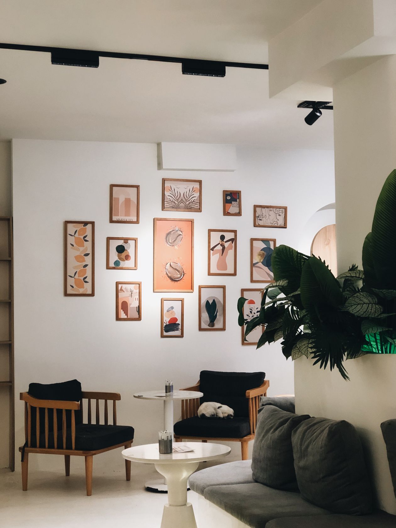 Gallery wall decor and wall design ideas with framed art and memories arranged as a feature wall